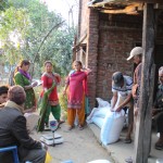 distributing seed to Kailash Krishi Group