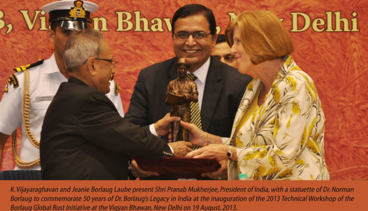 K. Vijayaraghavan and Jeanie Borlaug Laube present Shri Pranab Mukherjee